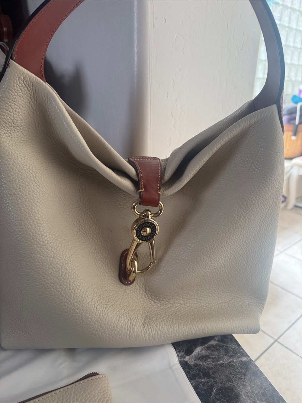 Dooney & Bourke Cream Leather Shoulder Bag with Brown Trim and Gold Hardware